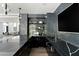 Wet bar featuring elegant dark marble countertops and glass shelving, perfect for entertaining guests at 6216 N 38Th Pl, Paradise Valley, AZ 85253