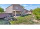 Wide backyard showing the home's exterior, patio area, and landscaping at 648 W Cobblestone Dr, Casa Grande, AZ 85122