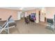 Neutral toned carpeted bedroom featuring ceiling fan and television for relaxation at 648 W Cobblestone Dr, Casa Grande, AZ 85122