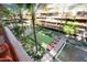 Overhead view of a tranquil courtyard with putting green and water features at 7137 E Rancho Vista Dr # 3003, Scottsdale, AZ 85251