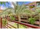 Balcony featuring views of the surrounding trees, courtyard, and buildings at 7137 E Rancho Vista Dr # 3003, Scottsdale, AZ 85251