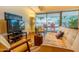 Cozy living room with stylish furniture and a view of the outdoor balcony at 7137 E Rancho Vista Dr # 3003, Scottsdale, AZ 85251