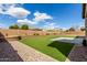 Backyard featuring artificial turf and desert landscaping at 7630 E Knoll St, Mesa, AZ 85207