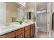 Bathroom featuring double vanity and a large framed mirror at 7630 E Knoll St, Mesa, AZ 85207