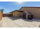 Exterior view featuring storage shed, landscaping and covered patio at 7630 E Knoll St, Mesa, AZ 85207