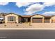 Charming home featuring desert landscaping and a spacious three car garage at 7630 E Knoll St, Mesa, AZ 85207