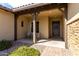 Covered front porch area with stone accents and a welcoming entrance at 7630 E Knoll St, Mesa, AZ 85207