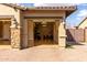 Attached garage with stone column accents and shiny epoxy floor at 7630 E Knoll St, Mesa, AZ 85207