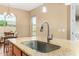 A kitchen island sink with stainless steel faucet and granite countertops reflects contemporary design at 7630 E Knoll St, Mesa, AZ 85207