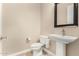 Powder room with decorative sink and a large framed mirror at 7630 E Knoll St, Mesa, AZ 85207