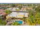 Yellow home with pool, desert landscaping, and pergola, offering an outdoor oasis at 7719 W Bluefield Ave, Glendale, AZ 85308