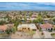 Spacious community featuring desert landscaping, tile roofs, and a charming yellow home at 7719 W Bluefield Ave, Glendale, AZ 85308