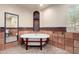 Elegant bathroom with freestanding tub, brick floors, and decorative tile accents at 7719 W Bluefield Ave, Glendale, AZ 85308