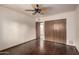 Bedroom featuring a closet and hardwood floors providing functional space at 7719 W Bluefield Ave, Glendale, AZ 85308