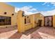 Side angle features the private courtyard with custom Saltillo tile and vintage lantern fixture at 7719 W Bluefield Ave, Glendale, AZ 85308