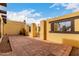 The home's spacious courtyard has custom Saltillo tile, rustic wooden beams and desert landscaping at 7719 W Bluefield Ave, Glendale, AZ 85308