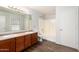 Bright primary bathroom with double sink vanity and tub shower at 8527 E Lindner Ave, Mesa, AZ 85209