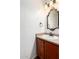 Elegant powder room features custom mirror and fixtures at 8527 E Lindner Ave, Mesa, AZ 85209