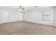 Spacious bedroom featuring neutral carpet and natural light at 8527 E Lindner Ave, Mesa, AZ 85209