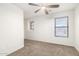 Bedroom featuring neutral carpet and two windows at 8527 E Lindner Ave, Mesa, AZ 85209