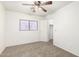 Bright bedroom with carpet floors, ceiling fan, window, closet and neutral walls, ready for personalization at 8527 E Lindner Ave, Mesa, AZ 85209