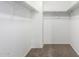 Walk-in closet with ample storage and carpeted floor at 8527 E Lindner Ave, Mesa, AZ 85209