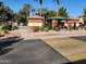 Attractive community entrance featuring well-maintained landscaping and secure gated access for residents at 8527 E Lindner Ave, Mesa, AZ 85209