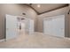 Spacious bedroom features vaulted ceiling, double-door closet, and neutral tile flooring at 8924 E Charter Oak Dr, Scottsdale, AZ 85260