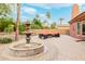 Charming outdoor fountain and patio seating area, creating a relaxing backyard ambiance at 8924 E Charter Oak Dr, Scottsdale, AZ 85260