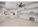 Spacious kitchen with white cabinetry, large island, and modern appliances at 8924 E Charter Oak Dr, Scottsdale, AZ 85260