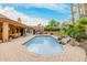 Inviting pool area with an outdoor kitchen and ample seating space, perfect for entertaining guests at 8924 E Charter Oak Dr, Scottsdale, AZ 85260