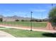 Baseball field and mountain view on a grassy field with mountain backdrop at 9012 E Sutton Dr, Scottsdale, AZ 85260