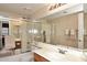 Bathroom with a large mirror, shower with glass doors, and white countertop at 9012 E Sutton Dr, Scottsdale, AZ 85260