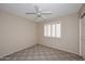 Bedroom featuring neutral walls, carpeted floors, and window with shutters at 9012 E Sutton Dr, Scottsdale, AZ 85260