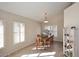 The dining room features ample natural light, neutral walls, tile floors, vaulted ceilings and custom decor at 9012 E Sutton Dr, Scottsdale, AZ 85260