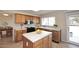 Kitchen with white tile countertops, oak cabinets, stainless appliances and eat-in area at 9012 E Sutton Dr, Scottsdale, AZ 85260