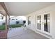 Covered patio with chairs overlooking a lush, green backyard at 9012 E Sutton Dr, Scottsdale, AZ 85260