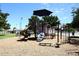 Well-equipped playground with climbing structures, slides and a sun shade at 9012 E Sutton Dr, Scottsdale, AZ 85260