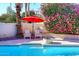 Swimming pool with patio and surrounding foliage in a beautiful backyard at 9012 E Sutton Dr, Scottsdale, AZ 85260