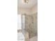 Updated shower with glass door and tiled walls adjacent to soaking tub and window at 9012 E Sutton Dr, Scottsdale, AZ 85260