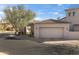 Exterior view of the garage, showing the architectural style and surrounding landscaping of the property at 9280 E Thompson Peak Pkwy # 29, Scottsdale, AZ 85255