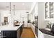 Well-lit kitchen featuring a center island with a black base, pendant lighting, and stainless steel appliances at 9280 E Thompson Peak Pkwy # 29, Scottsdale, AZ 85255