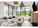 Bright living room featuring stylish seating, decorative lighting, a cozy rug, and a large window with a beautiful view at 9280 E Thompson Peak Pkwy # 29, Scottsdale, AZ 85255