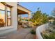 Outdoor living space with seating, a cozy lounge area, and lush greenery for serene relaxation at 9280 E Thompson Peak Pkwy # 29, Scottsdale, AZ 85255