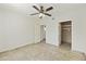 Light and bright bedroom with tile floors, ceiling fan, closet and attached bath at 9450 E Becker Ln # 2090, Scottsdale, AZ 85260