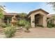 Welcoming clubhouse entrance with a decorative fountain and lush desert landscaping at 9450 E Becker Ln # 2090, Scottsdale, AZ 85260