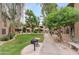 Beautiful courtyard featuring lush greenery, walkways, and inviting outdoor spaces at 9450 E Becker Ln # 2090, Scottsdale, AZ 85260