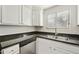 Functional kitchen featuring white cabinetry, dark countertops, and stainless steel appliances at 9450 E Becker Ln # 2090, Scottsdale, AZ 85260