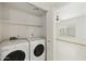 Bright laundry area features modern appliances and built-in shelving for efficient storage and organization at 9450 E Becker Ln # 2090, Scottsdale, AZ 85260