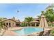 Resort-style community pool and grilling area, surrounded by lush landscaping and comfortable lounge seating at 9450 E Becker Ln # 2090, Scottsdale, AZ 85260